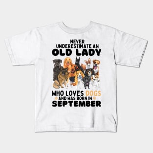 Never Underestimate An Old Lady Who Loves Dogs And Was September Kids T-Shirt